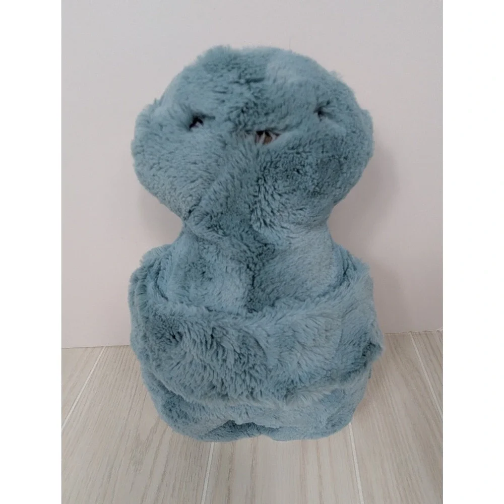 Mystery plush hugging arms Teal blue-green alien monster turtle Pom Bunny Tail